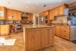 Fully stocked kitchen with granite counter tops and top of the line appliances